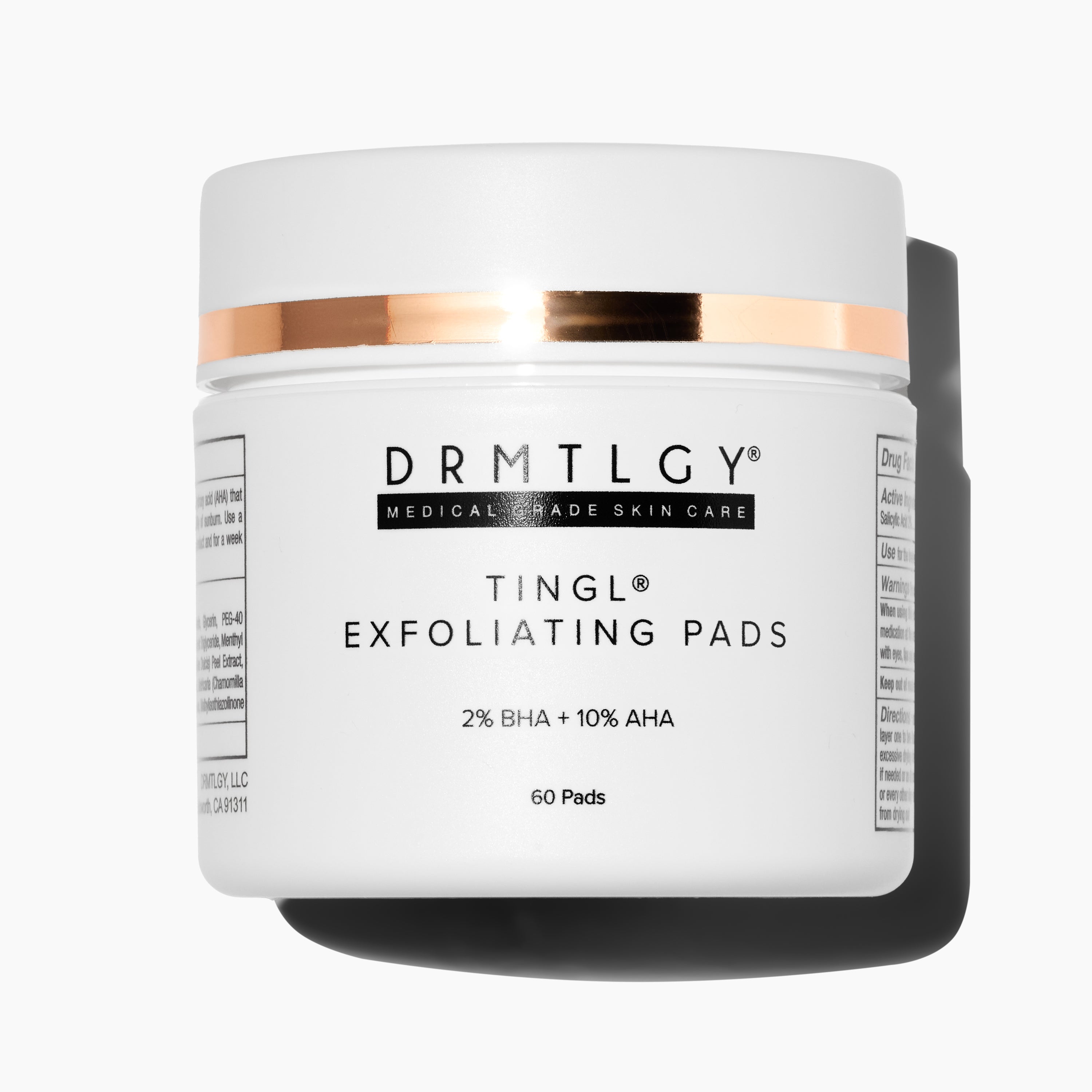 Blue bottle of DRMTLGY g(OAT) Cleanser with soap bubbles.