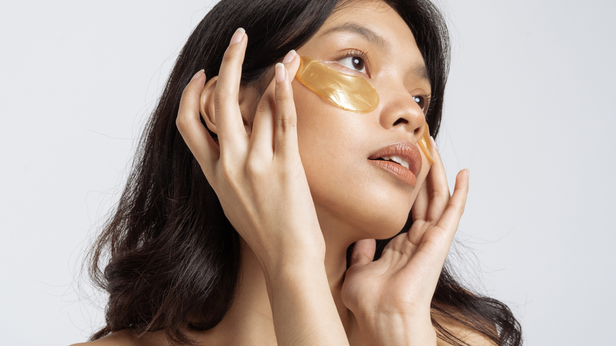 Woman applying under-eye patches for dark circles
